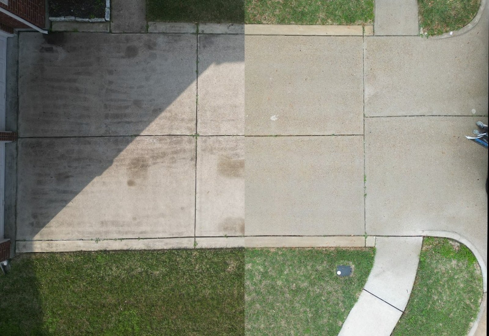 Before and after driveway cleaning on stained concrete