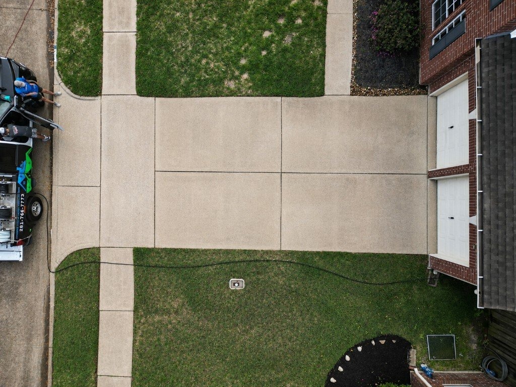 Clean concrete driveway after pressure cleaning
