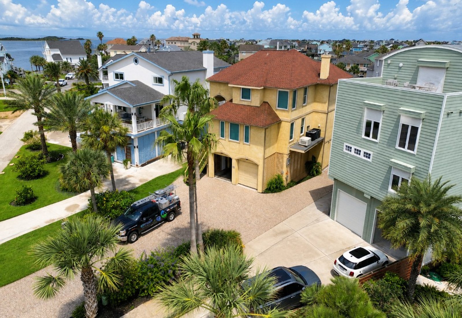 Service truck at a coastal home during house washing